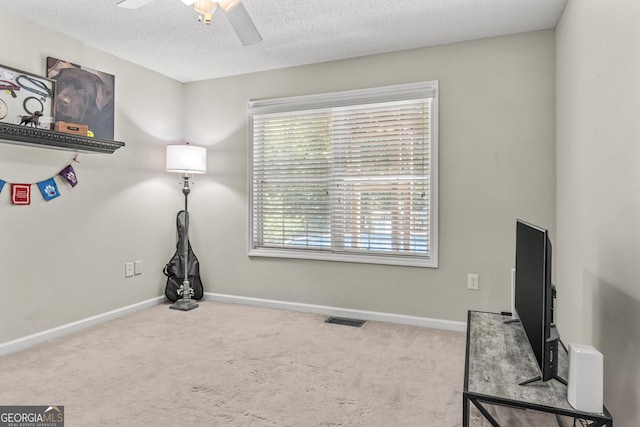 230 Hannah Dr, Colbert, GA 30628 - interior space with a ceiling fan, carpet flooring, a textured ceiling, and baseboards