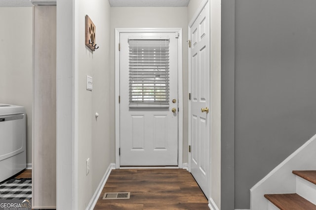 230 Hannah Dr, Colbert, GA 30628 - doorway to outside featuring washer / dryer, dark wood-style floors, stairs, and baseboards