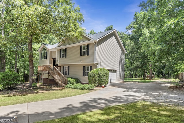 230 Hannah Dr, Colbert, GA 30628 - split foyer home featuring driveway, an attached garage, and stairway