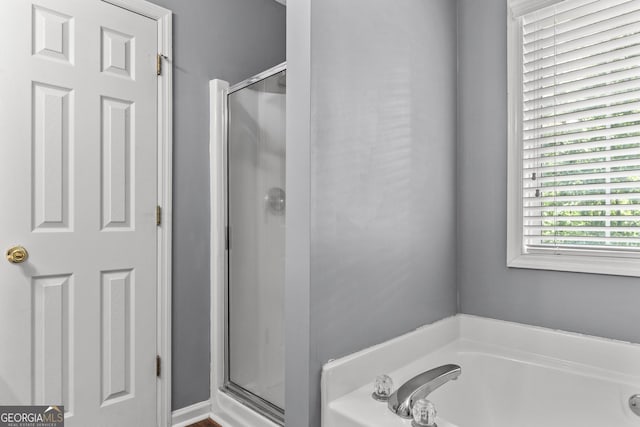 230 Hannah Dr, Colbert, GA 30628 - bathroom with a shower stall and a garden tub
