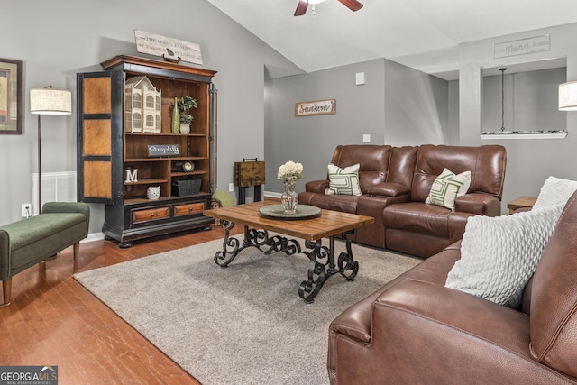 230 Hannah Dr, Colbert, GA 30628 - living area with wood finished floors, vaulted ceiling, ceiling fan, and baseboards