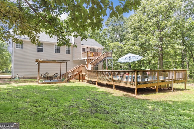 230 Hannah Dr, Colbert, GA 30628 - back of house featuring a deck, a yard, stairs, and a pergola