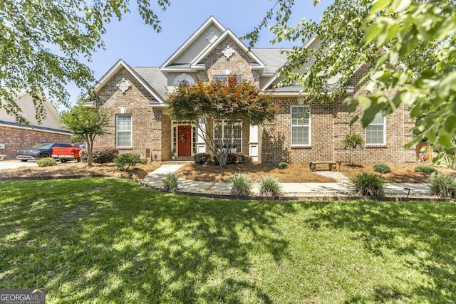 215 Wilsons Creek Bnd, Bonaire, GA 31005 - view of front facade with brick siding and a front lawn