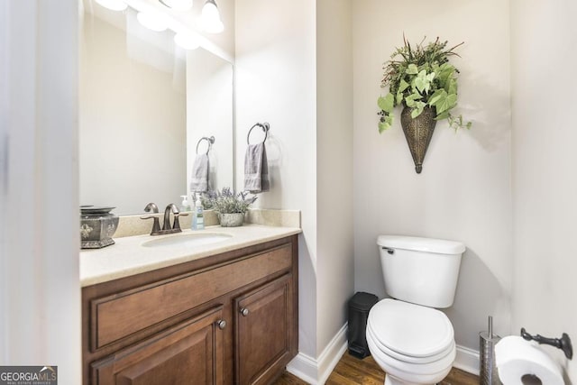 215 Wilsons Creek Bnd, Bonaire, GA 31005 - half bathroom with vanity, baseboards, toilet, wood finished floors, and a bidet