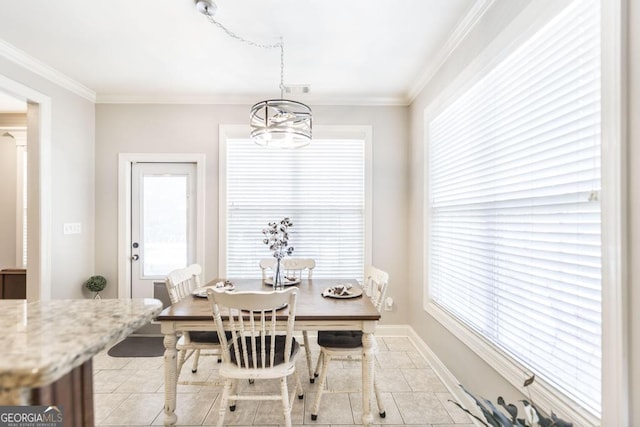 215 Wilsons Creek Bnd, Bonaire, GA 31005 - dining room featuring ornamental molding, light tile patterned floors, a chandelier, and baseboards