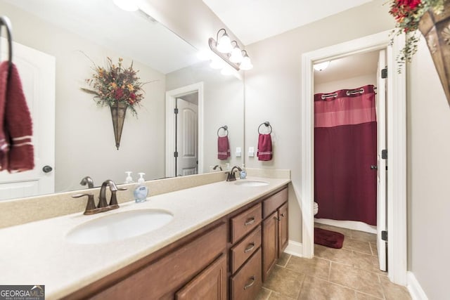 215 Wilsons Creek Bnd, Bonaire, GA 31005 - full bath featuring double vanity, toilet, and tile patterned floors