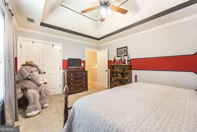 215 Wilsons Creek Bnd, Bonaire, GA 31005 - bedroom with light carpet, a raised ceiling, crown molding, a closet, and a ceiling fan