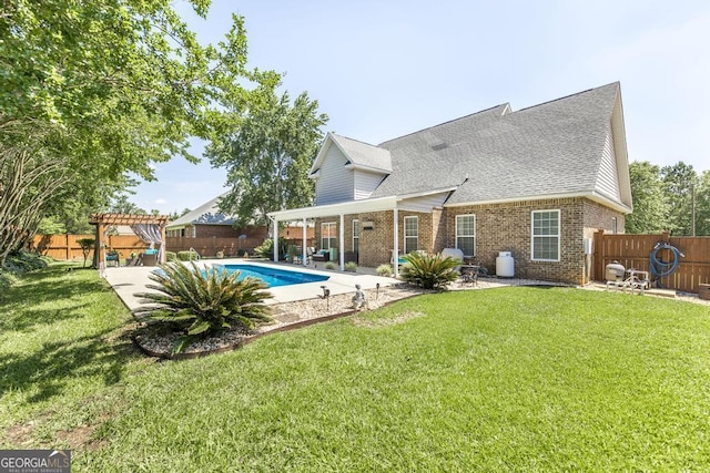215 Wilsons Creek Bnd, Bonaire, GA 31005 - back of property with brick siding, a patio, a shingled roof, and a pergola