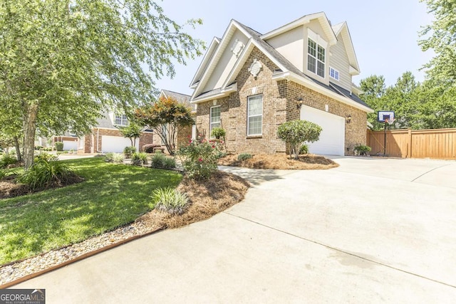 215 Wilsons Creek Bnd, Bonaire, GA 31005 - traditional-style house with driveway, an attached garage, brick siding, and stucco siding