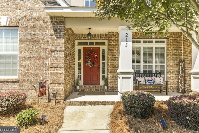 215 Wilsons Creek Bnd, Bonaire, GA 31005 - entrance to property with brick siding and covered porch
