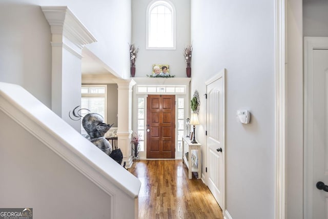 215 Wilsons Creek Bnd, Bonaire, GA 31005 - foyer featuring ornate columns, wood finished floors, and a high ceiling