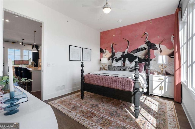 989 Bibbs Cir NW Unit 25, Atlanta, GA 30318 - bedroom featuring wood finished floors, an accent wall, access to exterior, and baseboards