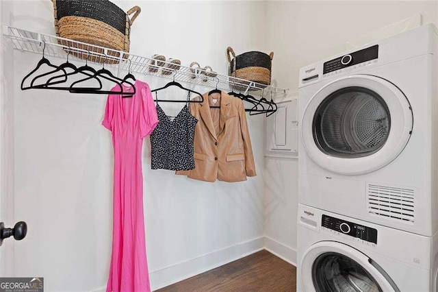 989 Bibbs Cir NW Unit 25, Atlanta, GA 30318 - laundry area with estacked washer and dryer, dark wood-style floors, and baseboards