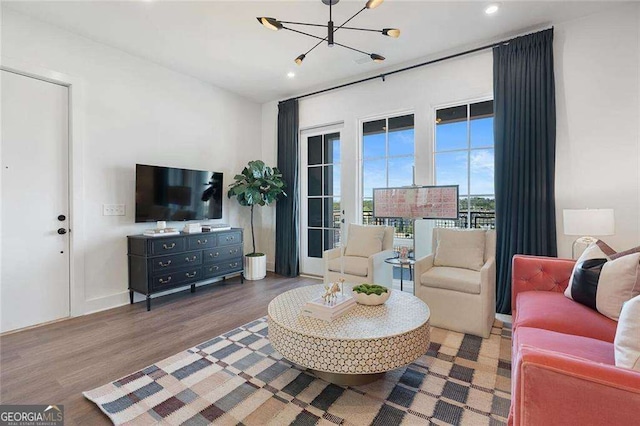989 Bibbs Cir NW Unit 25, Atlanta, GA 30318 - living area with a chandelier, wood finished floors, and recessed lighting