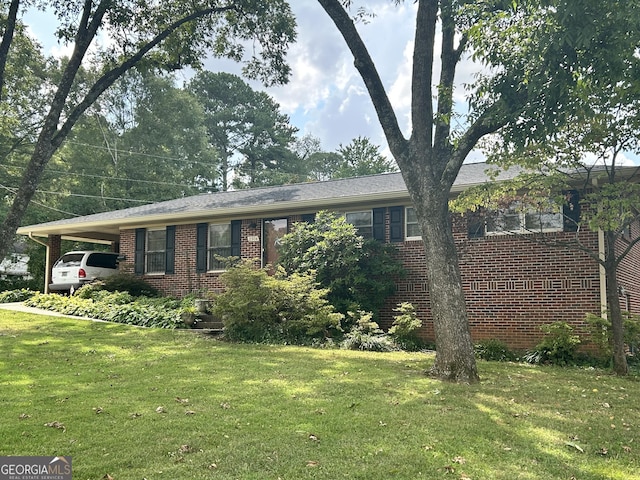 2334 Connally Dr, East Point, GA 30344 - single story home with brick siding, an attached carport, and a front lawn