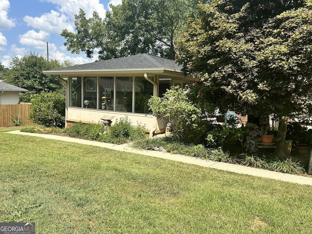 2334 Connally Dr, East Point, GA 30344 - view of front of house with a sunroom and roof with shingles