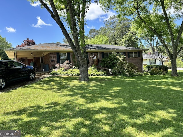 2334 Connally Dr, East Point, GA 30344 - view of front facade with a front yard, brick siding, and a carport