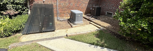 2334 Connally Dr, East Point, GA 30344 - exterior view of central AC, brick siding, and a power unit