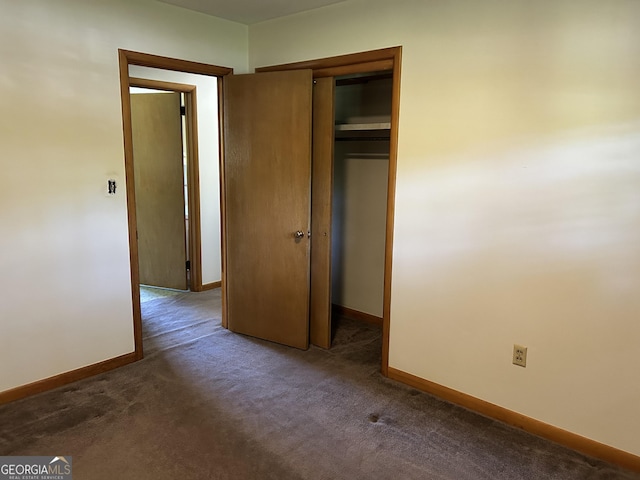 2334 Connally Dr, East Point, GA 30344 - unfurnished bedroom featuring baseboards, carpet flooring, and a closet