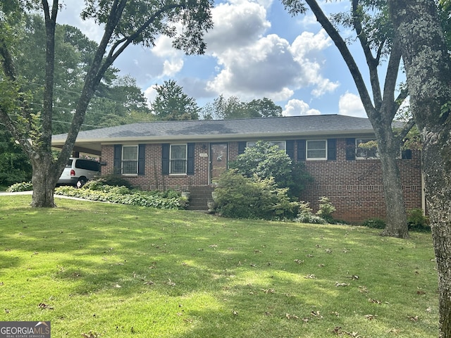 2334 Connally Dr, East Point, GA 30344 - single story home featuring brick siding, a front yard, and an attached carport