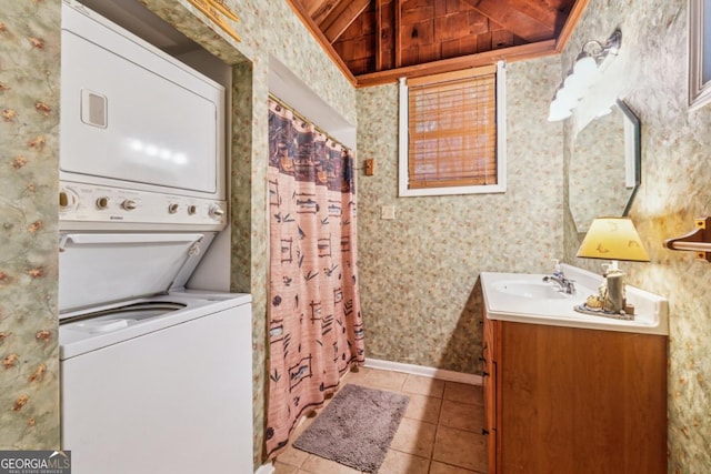 3644 Bert Dr, Gainesville, GA 30506 - laundry room featuring stacked washer / dryer, light tile patterned floors, and wallpapered walls