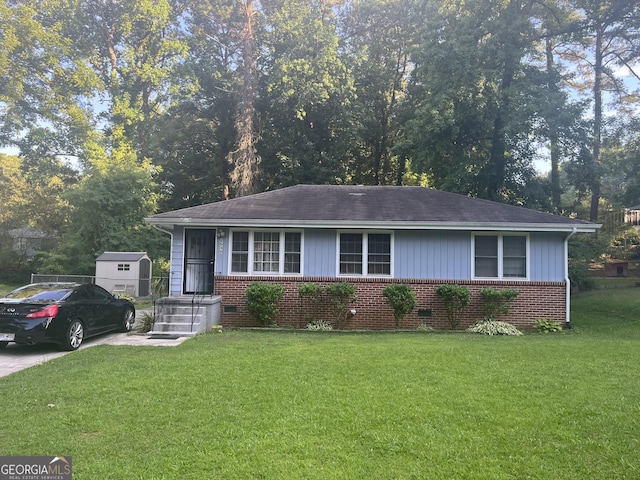 2530 Old Colony Rd, East Point, GA 30344 - view of front of property with brick siding, a front yard, and a shingled roof