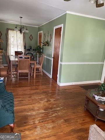 2530 Old Colony Rd, East Point, GA 30344 - dining space featuring a chandelier, ornamental molding, wood finished floors, and baseboards