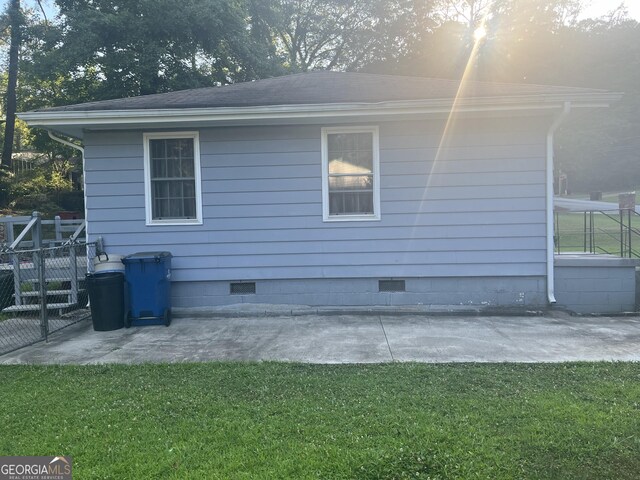 2530 Old Colony Rd, East Point, GA 30344 - view of property exterior with crawl space, a patio area, and roof with shingles
