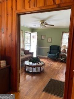 2530 Old Colony Rd, East Point, GA 30344 - living area featuring ornamental molding, light wood finished floors, and a ceiling fan