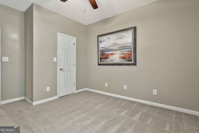 508 Las Brasis Ct, Peachtree City, GA 30269 - unfurnished bedroom featuring carpet floors, baseboards, a textured ceiling, and a ceiling fan