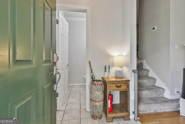 508 Las Brasis Ct, Peachtree City, GA 30269 - entryway featuring stairs, baseboards, and crown molding
