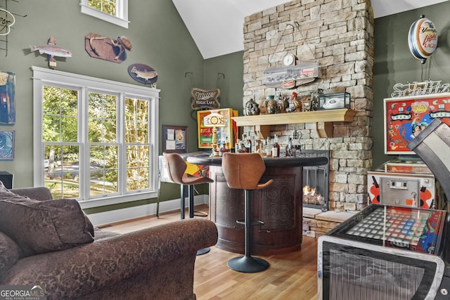 155 Bear Paw Ct, Clarkesville, GA 30523 - bar area with healthy amount of natural light, wood finished floors, and high vaulted ceiling