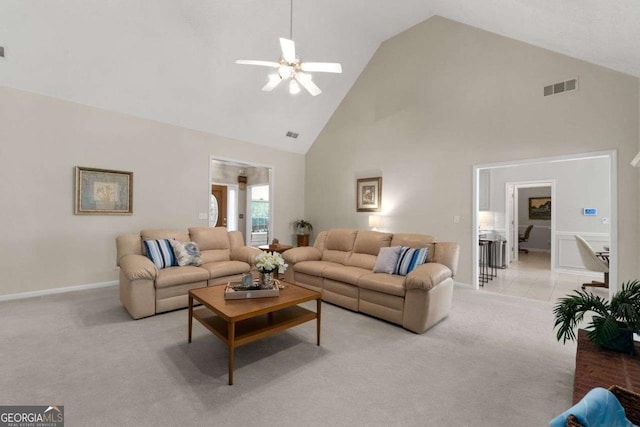 3027 Biltmore Woods Dr, Buford, GA 30519 - living area featuring high vaulted ceiling, light carpet, ceiling fan, and baseboards