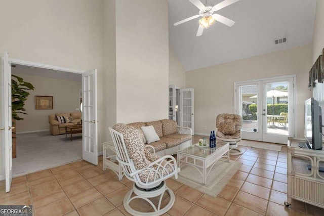 3027 Biltmore Woods Dr, Buford, GA 30519 - living area with french doors, high vaulted ceiling, light tile patterned floors, ceiling fan, and baseboards