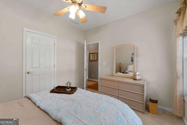 3027 Biltmore Woods Dr, Buford, GA 30519 - bedroom featuring light colored carpet, ceiling fan, and baseboards