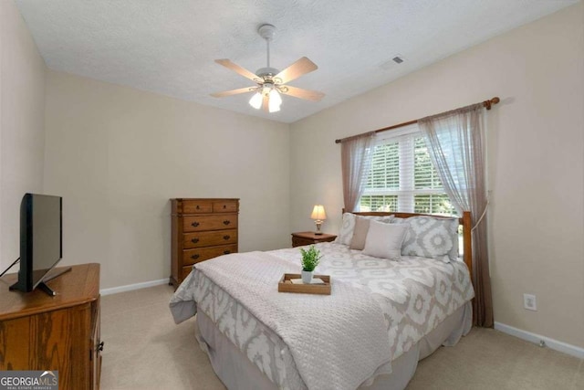 3027 Biltmore Woods Dr, Buford, GA 30519 - bedroom with light carpet, baseboards, and ceiling fan