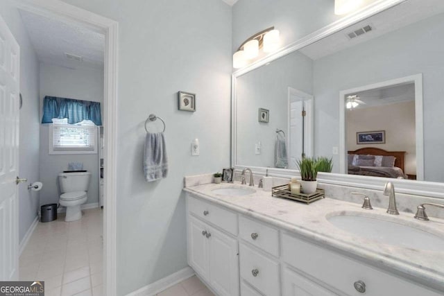 3027 Biltmore Woods Dr, Buford, GA 30519 - ensuite bathroom with double vanity, toilet, tile patterned floors, and baseboards