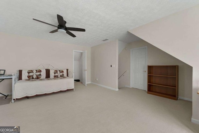 3027 Biltmore Woods Dr, Buford, GA 30519 - bedroom featuring a textured ceiling, carpet flooring, a ceiling fan, and baseboards