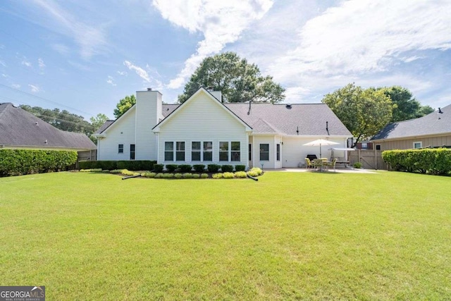 3027 Biltmore Woods Dr, Buford, GA 30519 - back of property with a patio and a chimney