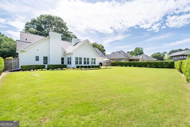 3027 Biltmore Woods Dr, Buford, GA 30519 - back of house with a chimney