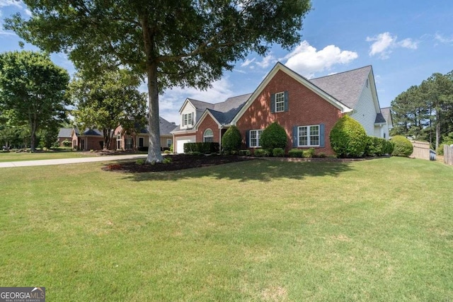 3027 Biltmore Woods Dr, Buford, GA 30519 - traditional-style house featuring brick siding, a front yard, and concrete driveway