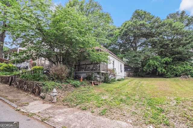 1052 Curran St, Atlanta, GA 30318 - view of property exterior featuring a lawn and a deck