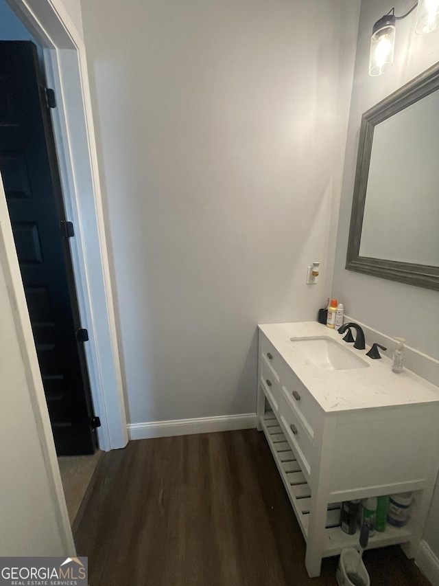 1333 Happy Hill Rd, Carrollton, GA 30116 - bathroom with wood finished floors, vanity, and baseboards