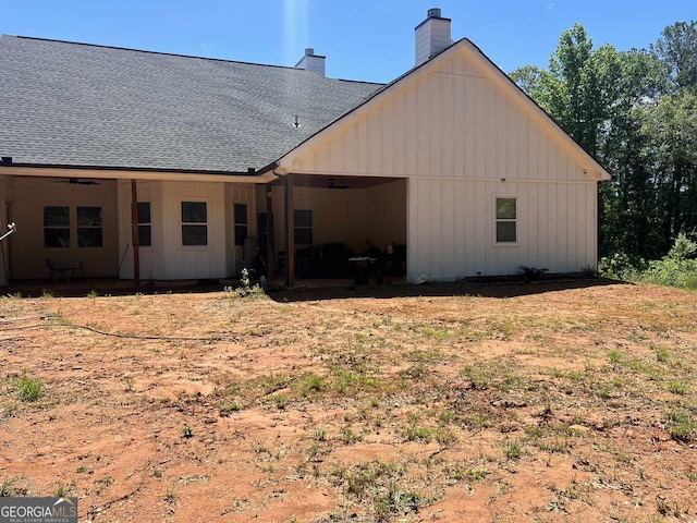 1333 Happy Hill Rd, Carrollton, GA 30116 - rear view of property with board and batten siding, a shingled roof, ceiling fan, and a chimney