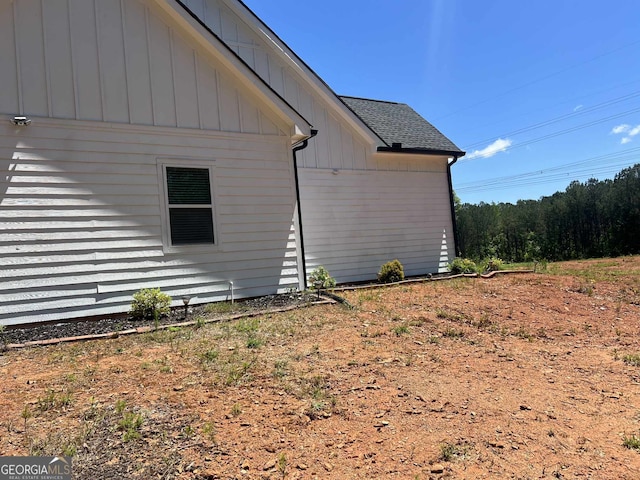 1333 Happy Hill Rd, Carrollton, GA 30116 - view of side of home with board and batten siding and roof with shingles
