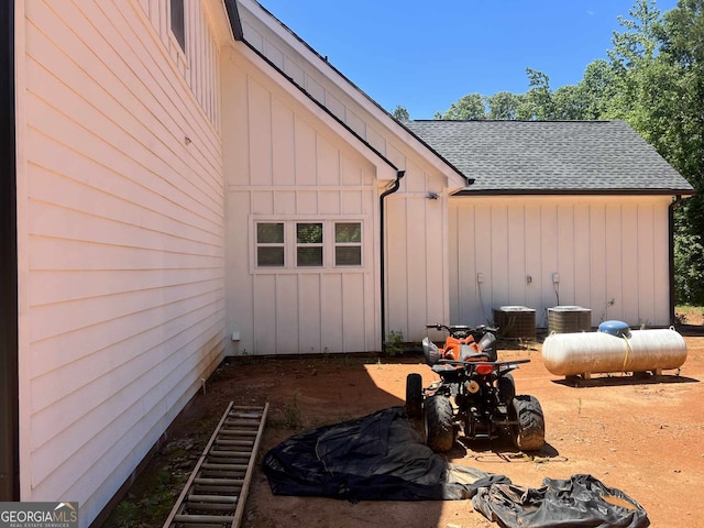 1333 Happy Hill Rd, Carrollton, GA 30116 - view of property exterior with a shingled roof, board and batten siding, and stairs