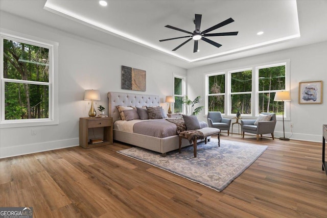 1604 Greendale Rd, Covington, GA 30014 - bedroom with a raised ceiling, baseboards, multiple windows, wood finished floors, and recessed lighting