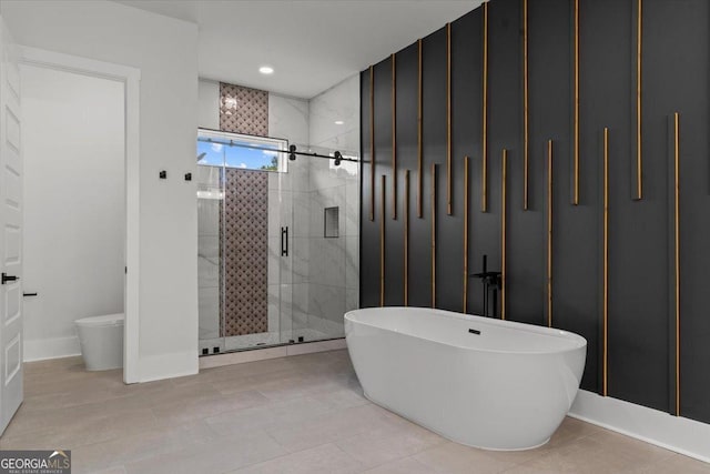 1604 Greendale Rd, Covington, GA 30014 - full bath featuring a soaking tub, a stall shower, and baseboards