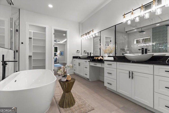 1604 Greendale Rd, Covington, GA 30014 - full bathroom with a stall shower, double vanity, a freestanding tub, and recessed lighting