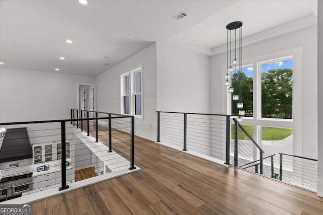 1604 Greendale Rd, Covington, GA 30014 - corridor featuring an upstairs landing, wood finished floors, and recessed lighting
